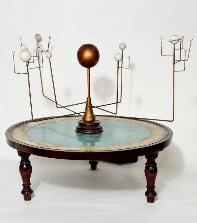 Orrery model on decorative base.